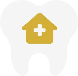 White tooth with gold house and cross.