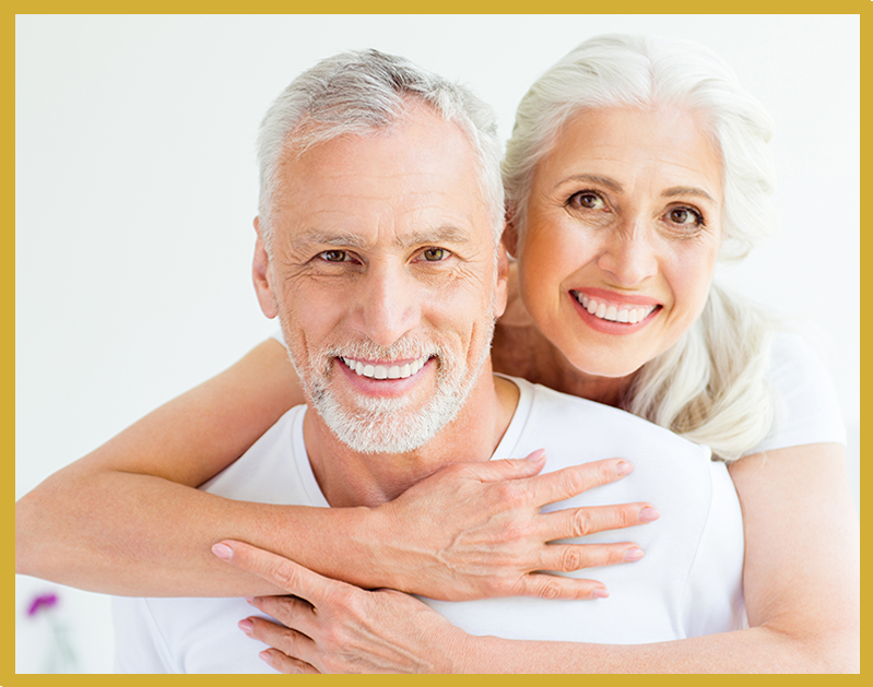 A man and woman smiling for the camera.